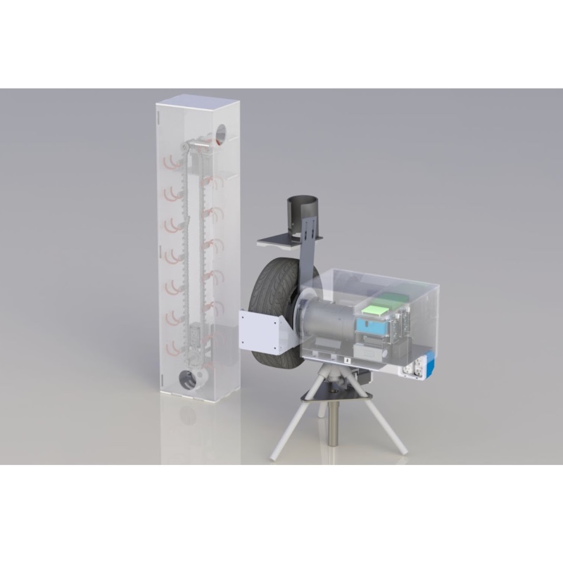 Picture of baseball fielding machine with acrylic housing and large treaded wheel, and ball feeder